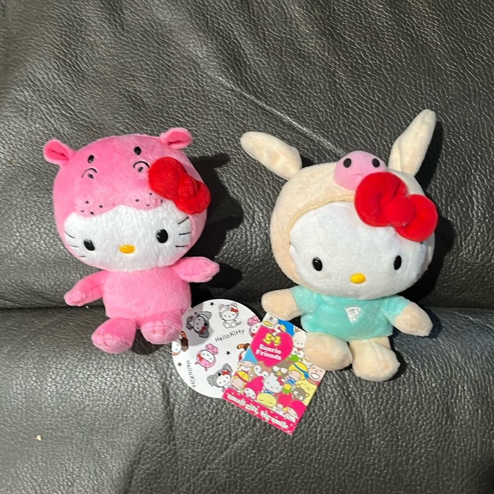 Two hello kitty in animal costumes